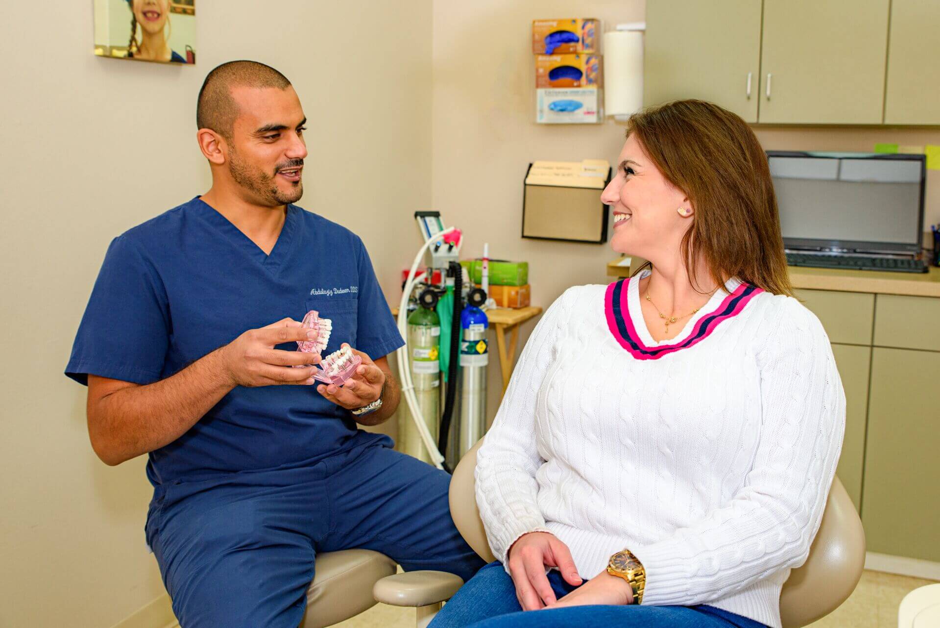Dr. Abdulaziz Dudeen of LOL Dental in consultation with a patient