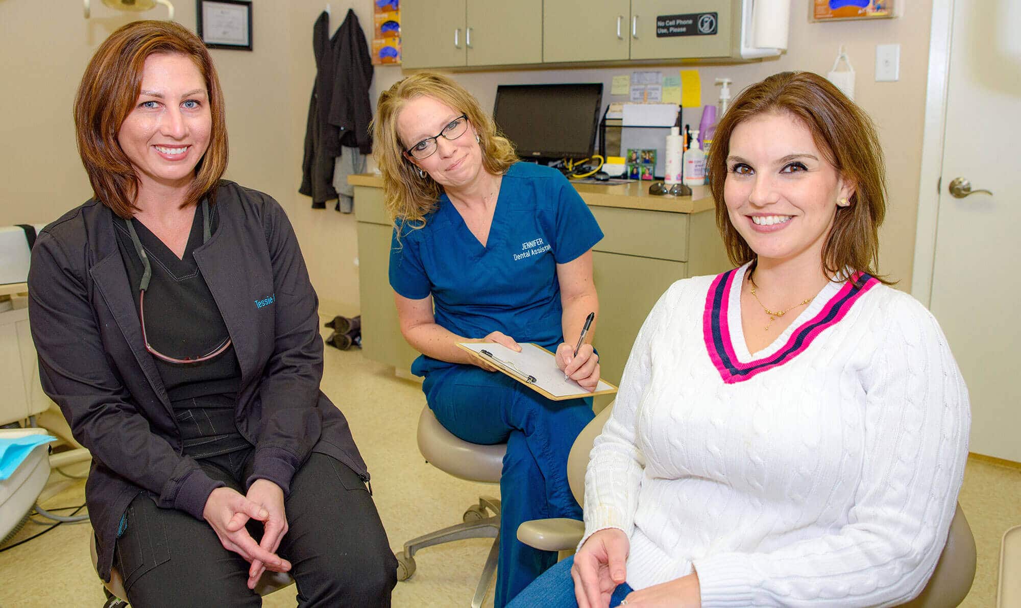 Tessie - Dental Hygienist & Jennifer – Dental Assistant With a patient after treatment